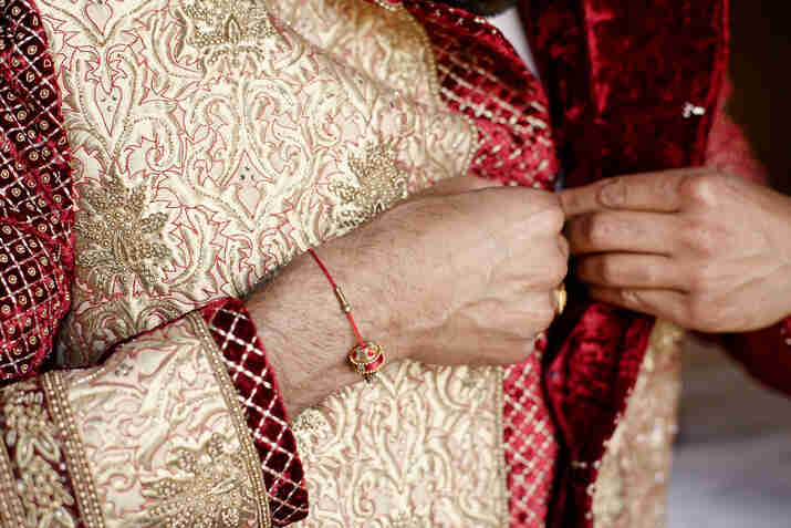 Man Wearing Ivory Sherwani for Summer Wedding 